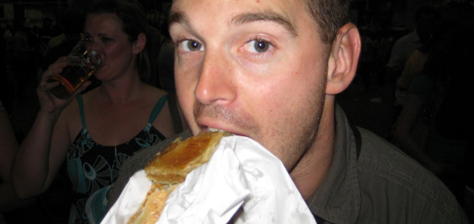 Paul enjoys half sausage roll at the Beer Festival (Jo in the background).  The other half fell on the floor ....