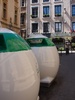 Huge recycling bins in the middle of an old street