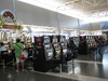 Slot machines in the baggage claim area - what is this place??