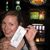 Gini shows off her winnings on the Irish Jigg slot machine.