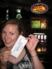 Gini shows off her winnings on the Irish Jigg slot machine.