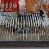 Interesting fast food snack, fish on a stick