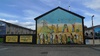 Mural based around the funding being cut for Education in the troubled areas