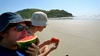 Nom nom nom on Watermelon on the beach