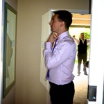 A swish looking James adjusts his tie