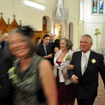 Followed by the parents arm in arm