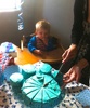 Jen cuts the Blues Clues footprint for Alex's first birthday party!