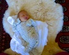 Quiet time on her new sheepskin