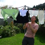 Dad hangs out the washing. So many small bits and pieces.