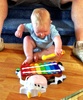 Olive gets her second early birthday present. A cool xylophone from Nan and Grandad.