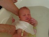 Ann, our midwife, gives Olive her first bath and she loves every minute.