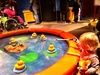 Fishing for ducks, looking in mirrors, playing cafe, digging for balls at science museum in Melbourne.