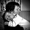Cuddles with mummy and daddy.