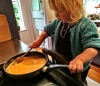 Olives love of being involved in everything continues as she helps make pancakes one morning and scrambled eggs the next. If you try doing it without her, she'll quickly drag over a 