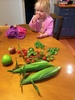 Not a bad vege garden haul. Olive went straight for the lone raspberry. First taste of our apples - they were yum.