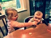 Olive feeds Iris her first solids! Apple banana mush followed by yoghurt. She seemed to enjoy it and want more!