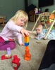 This morning Iris desperately wanted to join us building block towers. So she rolled over to join in.