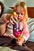 Playing with her purple slinky and tinkerbell