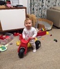 Iris has stated hopping on and off the trike by herself. She shuffles it round the room looking very proud of herself.