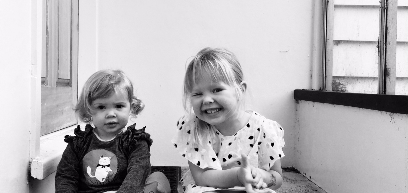 Peck girls hanging on their stoop.