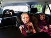 That's a relief. The three girls squeeze into the back of the car.
