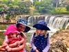 Everybody wanted to hold the baby at the picturesque Haruru Falls.