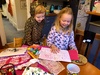 Olive taking Iris through the dozens of birthday cards she'd made for her at school in the weeks leading up to her birthday.