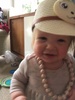 16 months: loving walking, stopped crawling straight away. Always seems to have a necklace on or something on her head. Very chatty too.