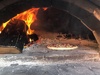 Cooking pizza on holiday - got to build ourselves one of these!