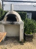Cooking pizza on holiday - got to build ourselves one of these!