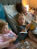While daddy has been recovering, reading in bed with us has become a routine,...