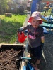 Loves hanging off the monkey bars... got into the planting and watering...