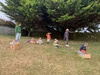 KPC Tamariki Nui: at Ben burn park, painting boxes and sliding down the hills, ball and parachute play.