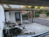 Reno day 3: gutting the two rooms, finding 2 mummified rats and bird nests to boot. Carport roof is no more.