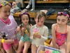 Juni’s early birthday party, at the pool with takeaway snack boxes.