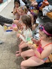Juni’s early birthday party, at the pool with takeaway snack boxes.