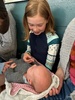 Everyone gets to hold baby Sabin.