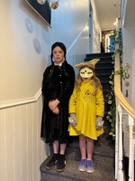 Book day! Iris as Wednesday (originally a comic) and Juni is sunrise from wolfgirl.