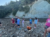 Bbq with fire on the riverbed.