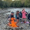 Bbq with fire on the riverbed.