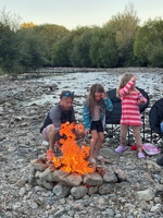 Bbq with fire on the riverbed.
